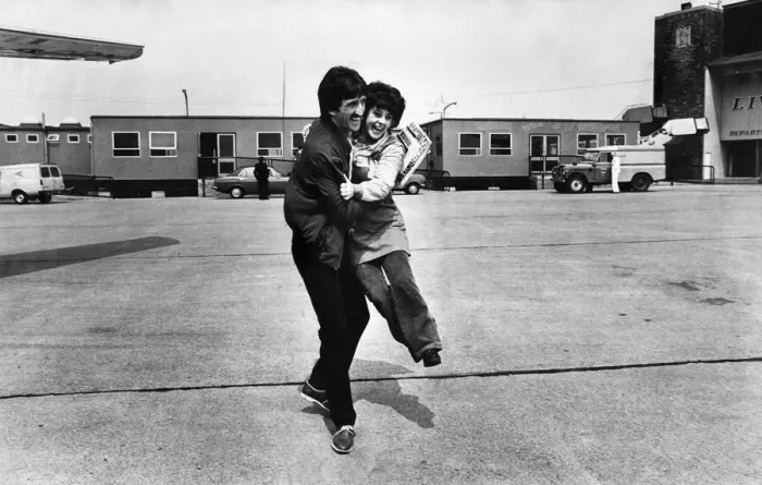 Framed Print : Liverpool footballer David Johnson receives an enthusiastic embrace as the team depart Framed Print : Liverpool footballer David Johnson receives an enthusiastic embrace as the team depart