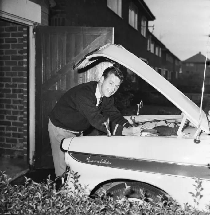 Framed Print : Liverpool footballer Gordon Milne, pictured at his home, checking the engine of his car Framed Print : Liverpool footballer Gordon Milne, pictured at his home, checking the engine of his car