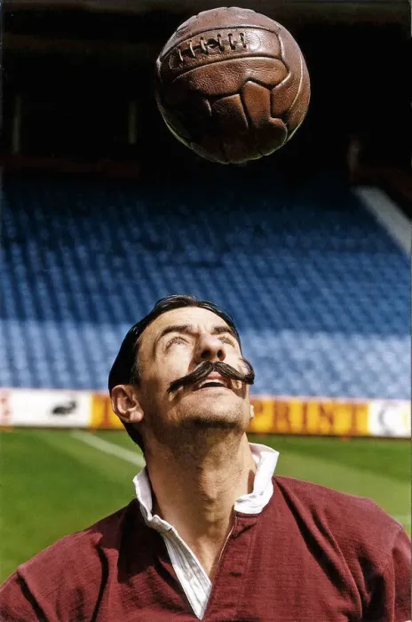 Framed Print : Liverpool footballer Ian Rush wears the Liverpool strip of 100 years ago including fake