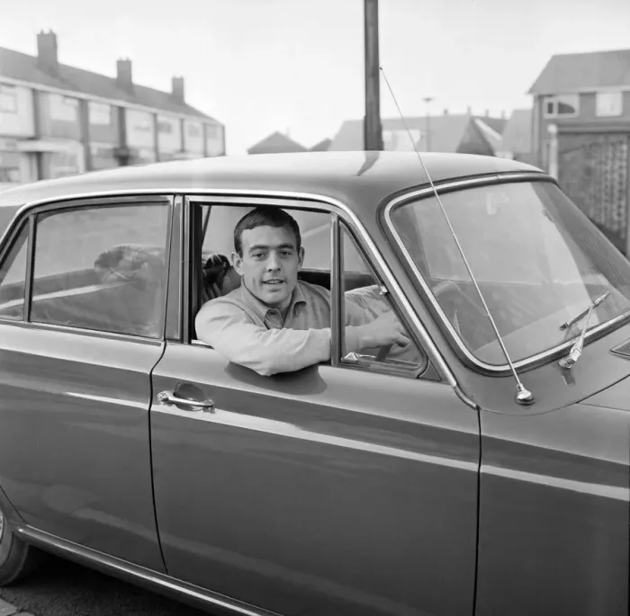 Framed Print : Liverpool footballer Ian St. John with his new Ford Cortina in Liverpool Framed Print : Liverpool footballer Ian St. John with his new Ford Cortina in Liverpool