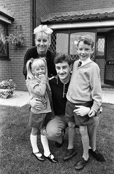 Liverpool footballer John Aldridge at home with his family. 13th September 1989