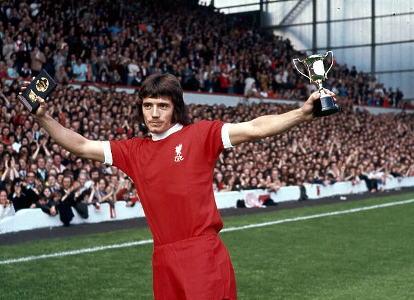 Liverpool footballer Kevin Keegan shows off his Best Youngster of the Year Award before a