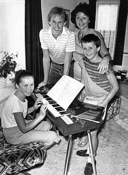 Liverpool footballer Phil Neal with wife Sue and their children at home