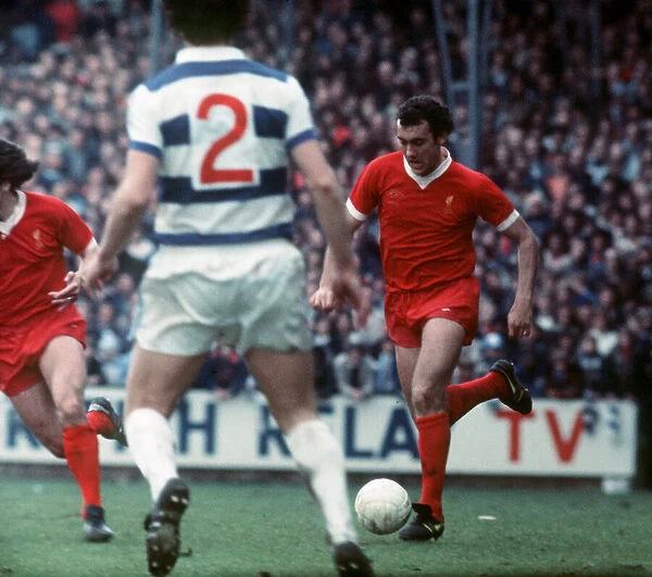 Liverpool footballer Ray Kennedy running with the ball during the League Division One