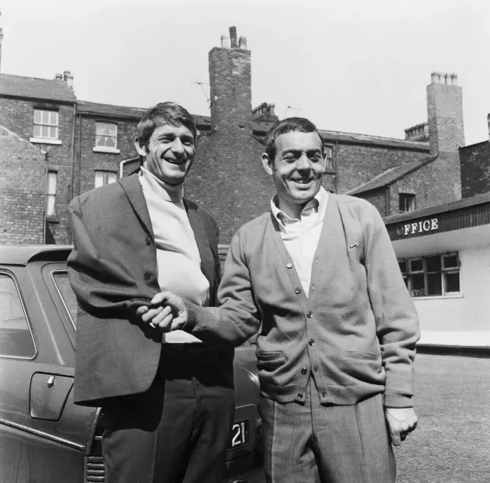 Framed Print : Liverpool footballer Roger Hunt receives an armless handshake from Ian St John as he Framed Print : Liverpool footballer Roger Hunt receives an armless handshake from Ian St John as he