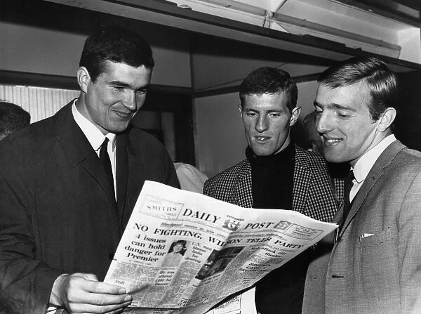 Liverpool footballers Ron Yeats, Willie Stevenson and Peter Thompson glancing at the back