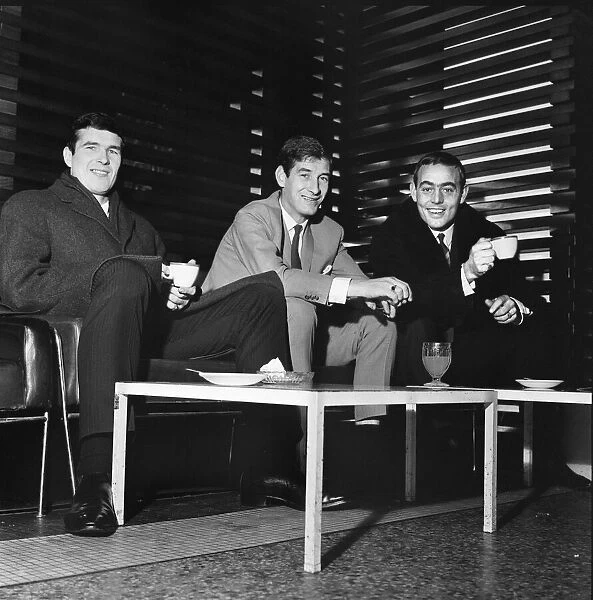 Liverpool footballers Ron Yeats, Geoff Strong and Ian St John enjoy a quick drink of