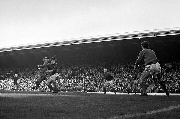 Liverpool forward Alun Evans shoots at the manchester United goal as Nobby Stiles