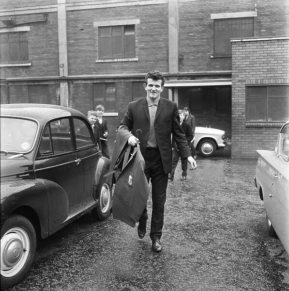 Liverpool goalkeeper Tommy Lawrence picks up his new suit ahead of the team