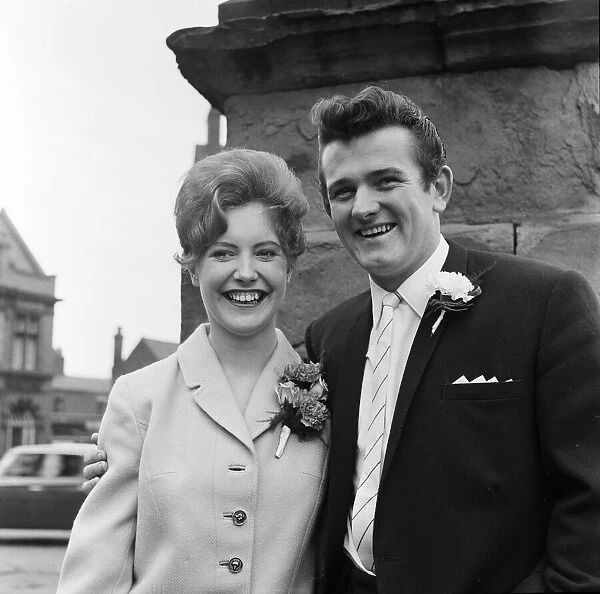 Liverpool goalkeeper Tommy Lawrence poses with his 19 year old bride Judith price after