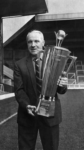 Liverpool manager Bil Shankly poses with his Manager of the Year Award at Anfield