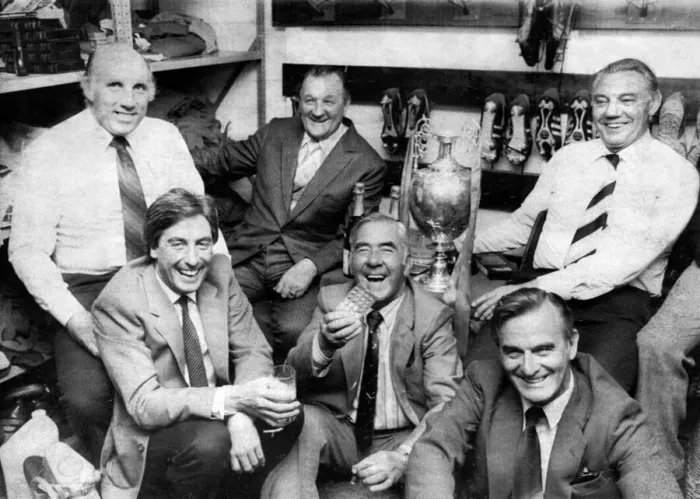 Framed Print : Liverpool manager Bob Paisley in the boot room with his staff left to right Framed Print : Liverpool manager Bob Paisley in the boot room with his staff left to right