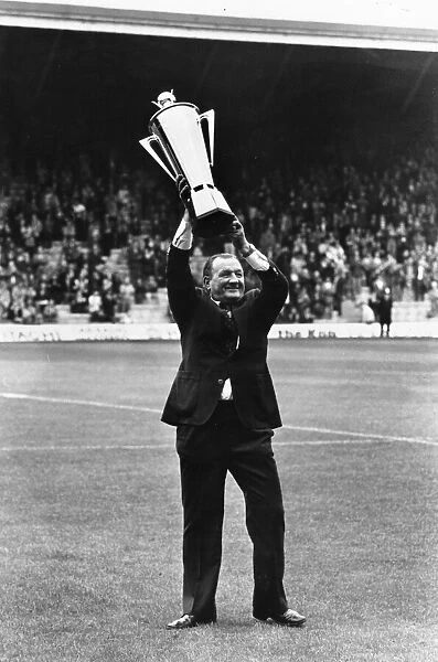 Liverpool manager Bob paisley holds aloft his Manager of the Year Award before the match