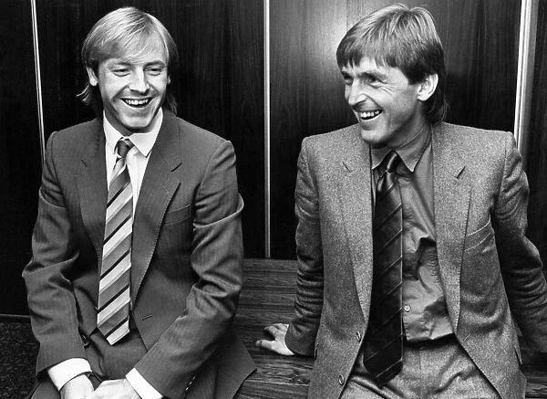 Liverpool manager Kenny Dalglish shares a joke with his new signing Steve McMahon