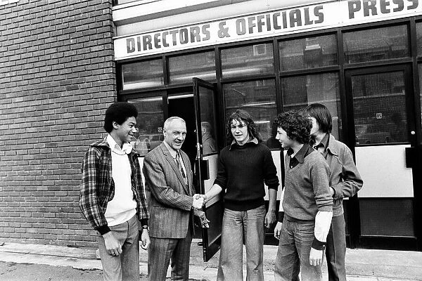 Liverpool manager Bill Shankly greets young fans outside the directors office at Anfield