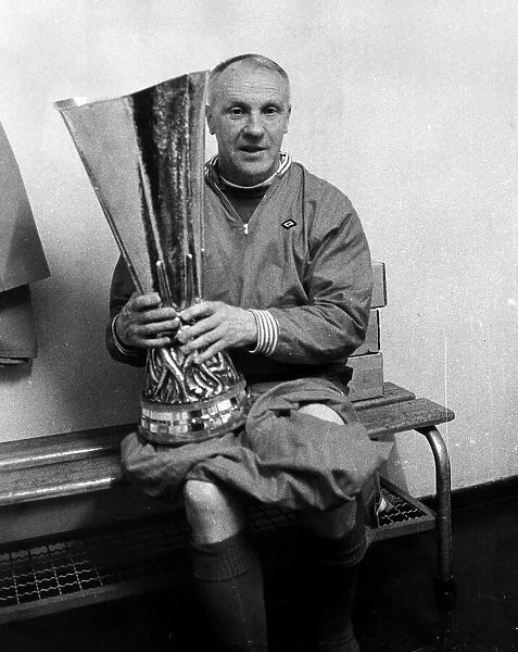 Liverpool manager Bill Shankly holding the UEFA Cup trophy after his side defeated