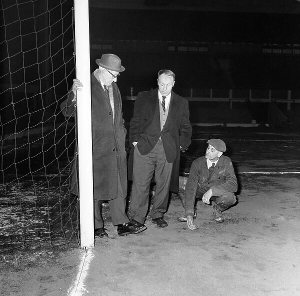 Liverpool manager Bill Shankly inspecting the Anfield pitch with chairman T V Williams