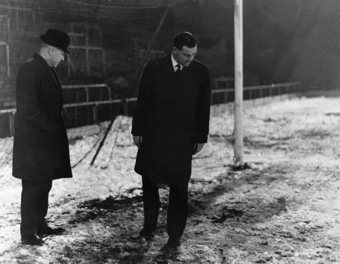 Framed Print : Liverpool manager Bill Shankly inspecting the snow covered pitch before a match Framed Print : Liverpool manager Bill Shankly inspecting the snow covered pitch before a match