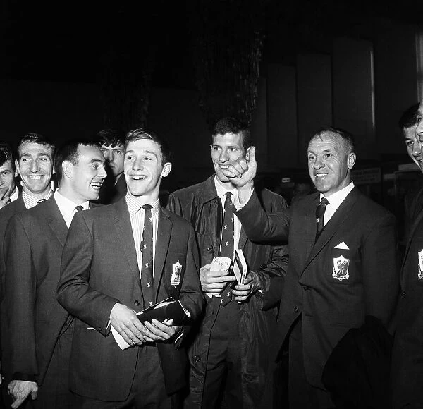 Liverpool manager Bill Shankly has a joke with his players at Ringway airport