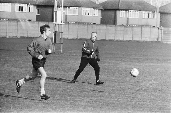 Liverpool manager Bill Shankly keeps a close eye on Liverpool forward Peter Thompson as