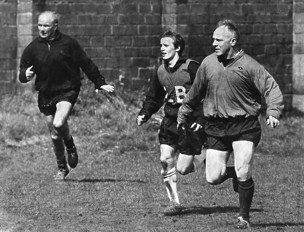 Liverpool manager Bill Shankly (right) takes part in a training session at Melwood with