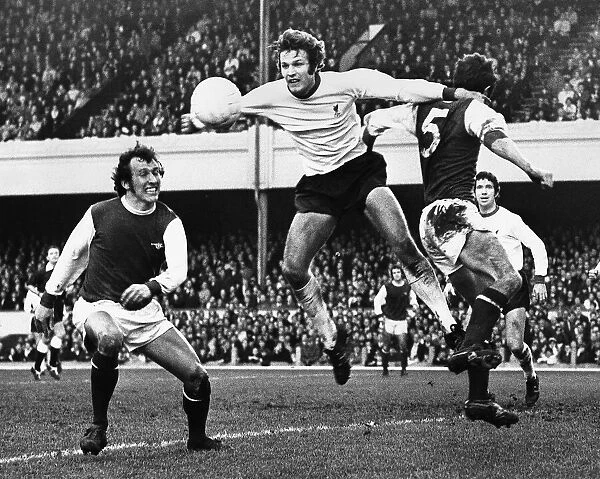 Liverpool new boy John Toshack challenges Frank McLintock for the ball during the league