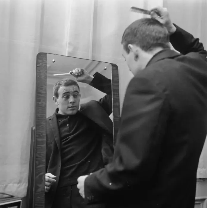 Framed Print : Liverpool player Ian St John looks in the mirror to comb his hair as he gets ready for Framed Print : Liverpool player Ian St John looks in the mirror to comb his hair as he gets ready for