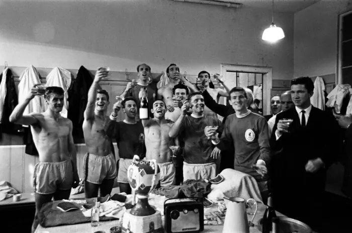 Framed Print : Liverpool players celebrate in the dressing room after beating Arsenal 5-0 to win Framed Print : Liverpool players celebrate in the dressing room after beating Arsenal 5-0 to win