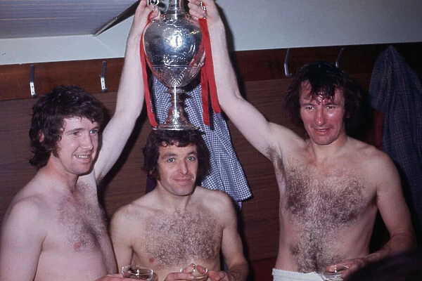 Liverpool players Chris Lawler, Ian Callaghan and Tommy Smith celebrate wiing the League