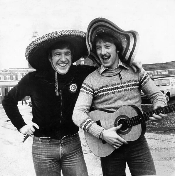 Liverpool players Emlyn Hughes and Jimmy Case both wearing sombrero hats as they arrive