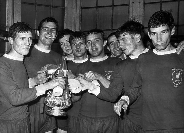 Liverpool players enjoy a drink after winning FA Cup final against Leeds United (2-1)