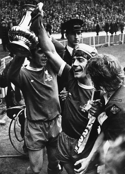 Liverpool players Kevin and Keegan celebrate with the FA Cup trophy following their 3-0
