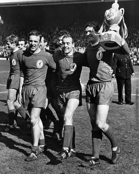 Liverpool players Peter Thompson, Ian St John and club captain Ron Yeats celebrate with
