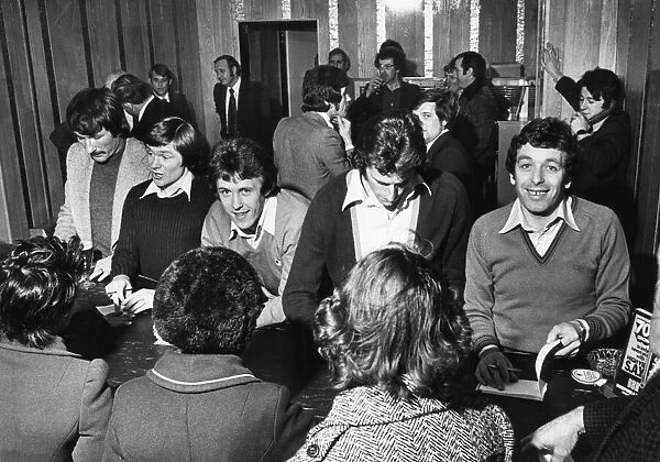 Liverpool players Tommy Smith, Brian Hall, Jimmy Case and Ray Clemence sign autographs