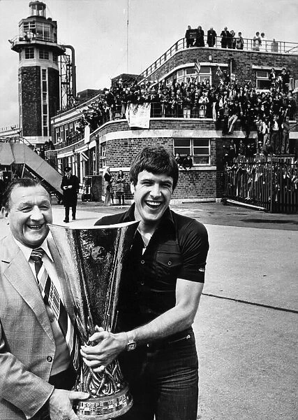 Liverpool return home with the UEFA Cup. Jubilant manager Bob Paisley