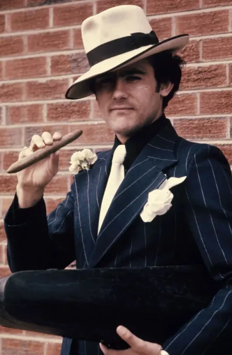 Framed Print : Liverpool star Ray Kennedy smoking a cigar dressed as Chicago gangster Al Capone Framed Print : Liverpool star Ray Kennedy smoking a cigar dressed as Chicago gangster Al Capone