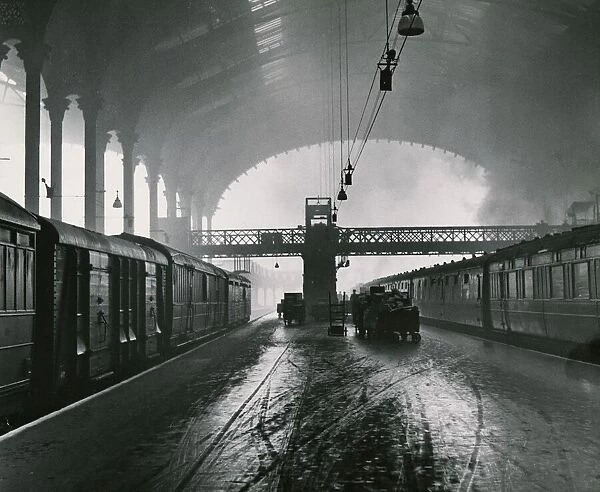 Liverpool Street Station in London The Arched roof is filed with smoke from a steam