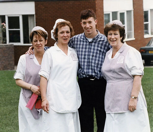 Liverpool striker Robbie Fowler meets up with the dinner ladies at his old school Nugent
