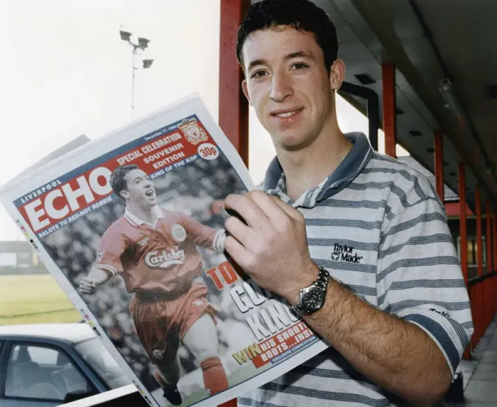 Framed Print : Liverpool striker Robbie Fowler reading the Liverpool Echo Special Celebration Souvenir