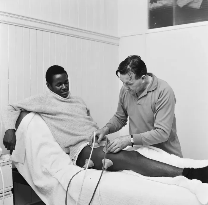 Framed Print : Liverpool team trainer Bob Paisley tends to William Louther Framed Print : Liverpool team trainer Bob Paisley tends to William Louther