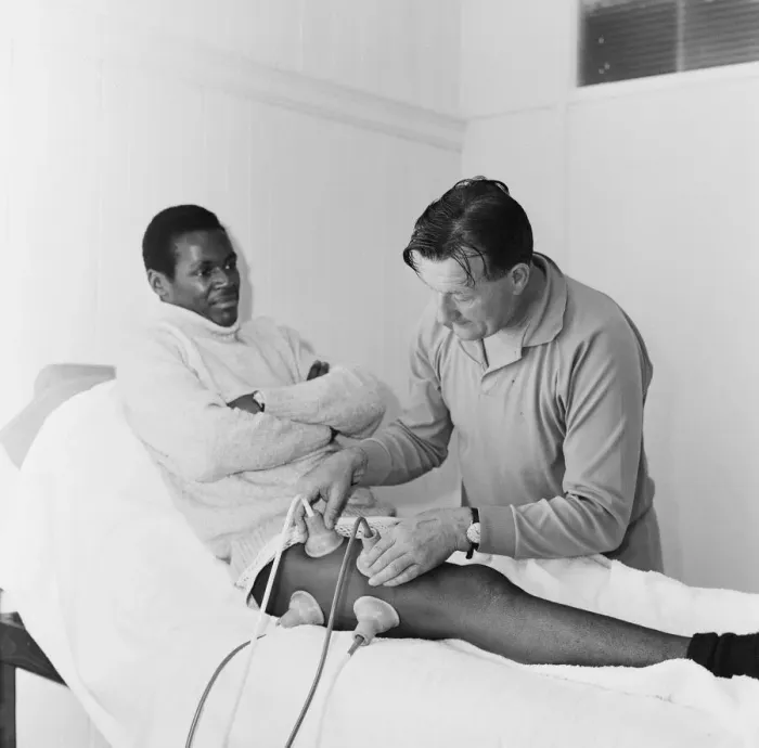 Framed Print : Liverpool team trainer Bob Paisley tends to William Louther Framed Print : Liverpool team trainer Bob Paisley tends to William Louther