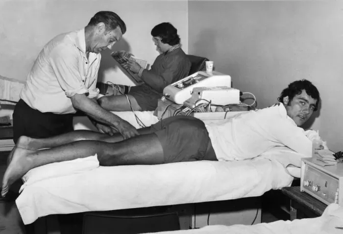 Framed Print : Liverpool trainer Joe Fagan helps injured player Ray Kennedy back to fitness while Chris
