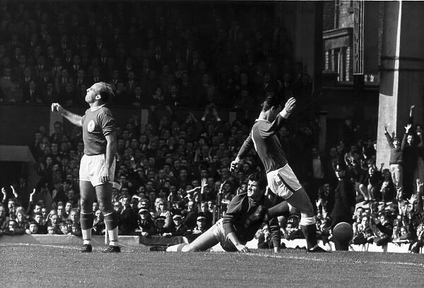 Liverpool v. Everton. Liverpool defender Ronnie Moran is furious as Everton