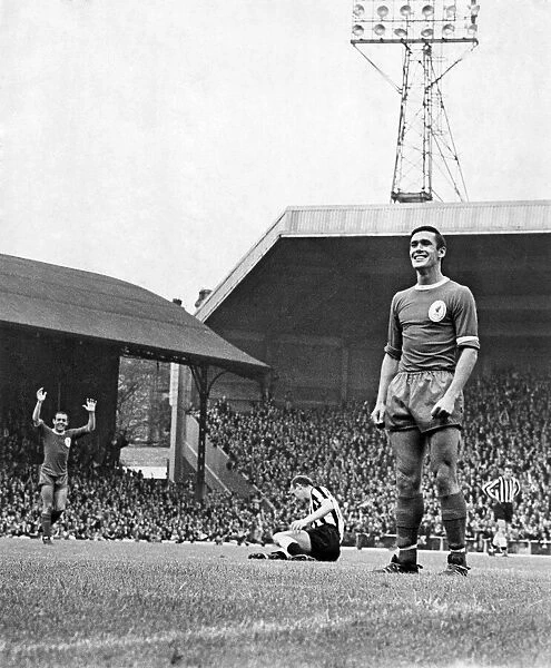 Liverpool v. Newcastle. Tony Hateley stands proudly looking into the goal after scoring