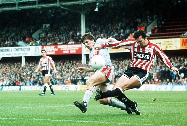 Liverpools Peter Beardsley challenges Neil Ruddock of Southampton for the ball