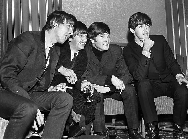 Liverpudlian pop group The Beatles relaxing backstage at The Regal Cinema in Cambridge