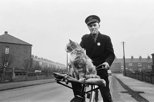 Liverton postman takes his cat on post rounds in Redcar, Cleveland. Circa 1971