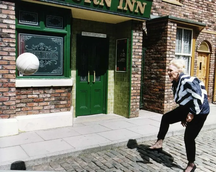 Framed Print : Liz Dawn Actress plays Vera in Coronation Street as she practices for a charity football
