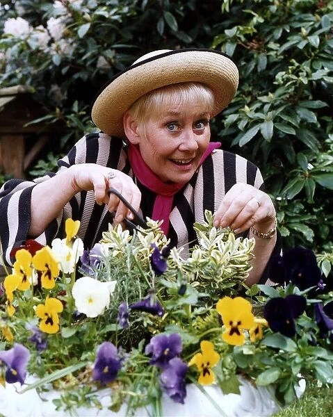 Liz Dawn actress who plays the part of Vera Duckworth in Coronation Street in her garden