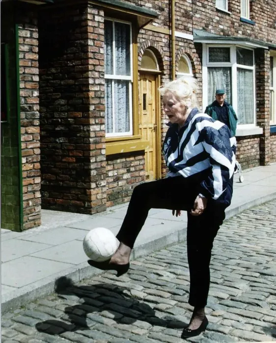 Framed Print : Liz Dawn Actress who plays the part of Vera Duckworth in Coronation Street kicks football Framed Print : Liz Dawn Actress who plays the part of Vera Duckworth in Coronation Street kicks football
